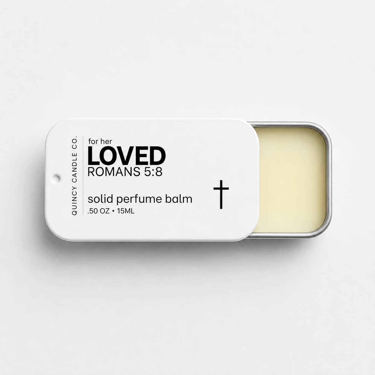 A tin of Quincy Candle Co. solid perfume balm with the lid partially slid off, showing the pale yellow balm inside.
