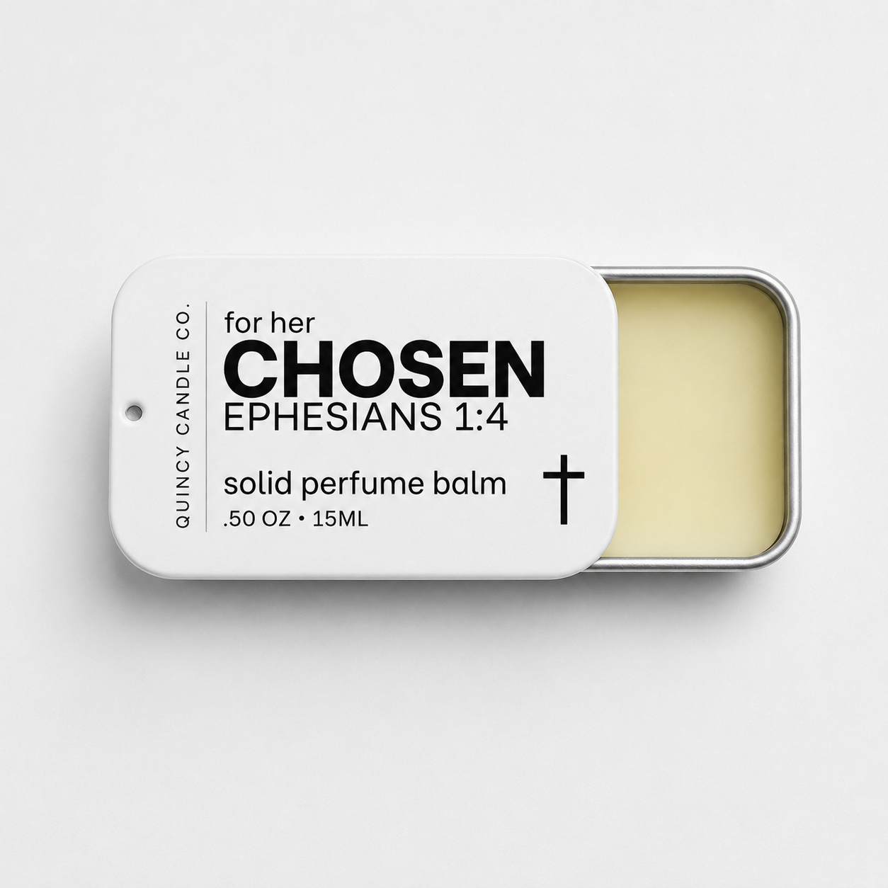 A silver metal tin of solid perfume balm with a white lid sliding off to the left, showing the pale yellow balm inside. The lid features black text reading 'for her CHOSEN EPHESIANS 1:4' and 'QUINCY CANDLE CO.